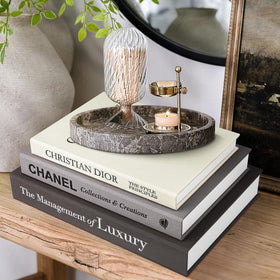 1DOT2 decorative books in black linen on a coffee table to elevate modern decor
