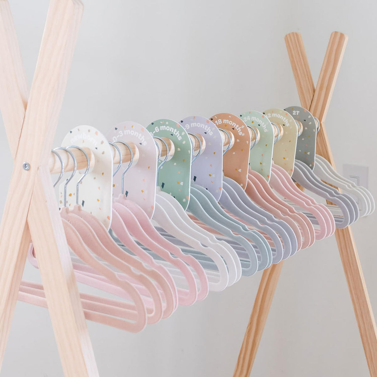 3 Sprouts Velvet Baby Hangers with swivel—easy access to every garment.