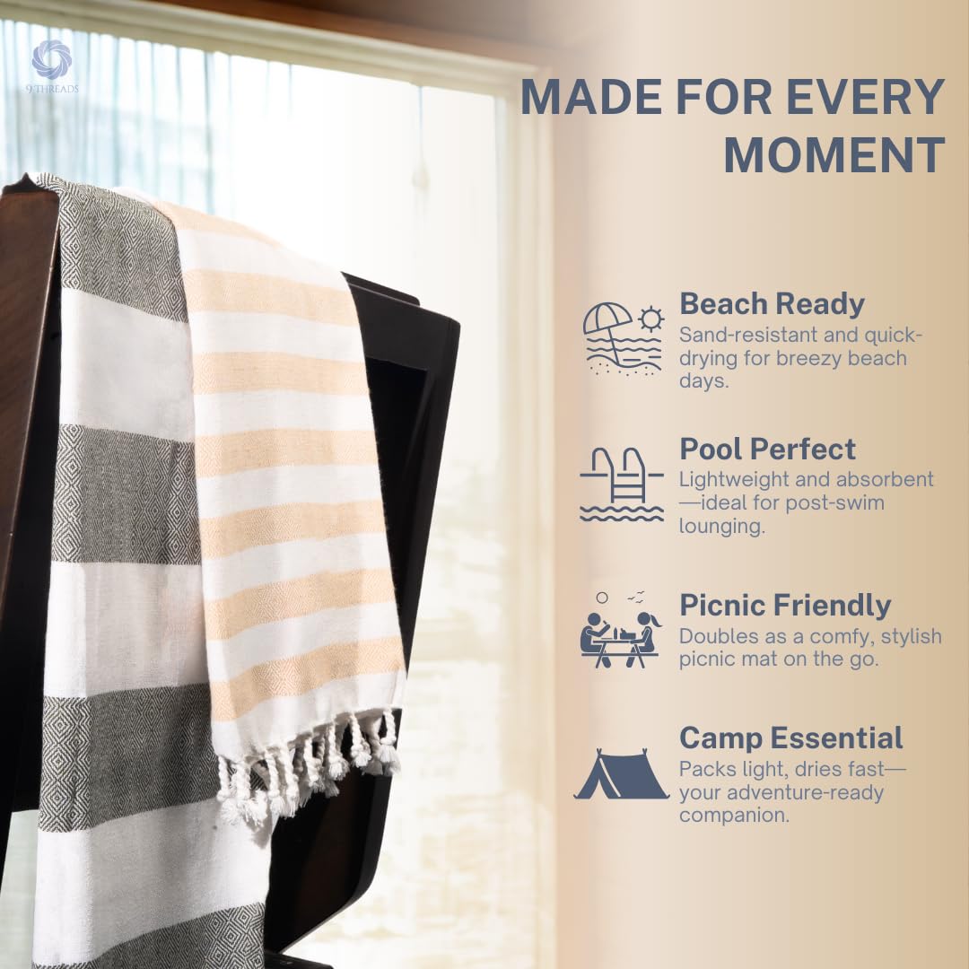 Oversized 36x72 inch towel spread on sand for lounging area