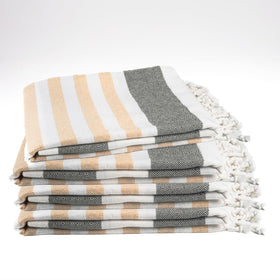 9Threads Sage & Sand Turkish beach towel laid flat for sand-free beach days