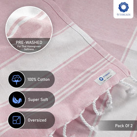 9Threads towel on sand shows absorbent, fast-drying performance.