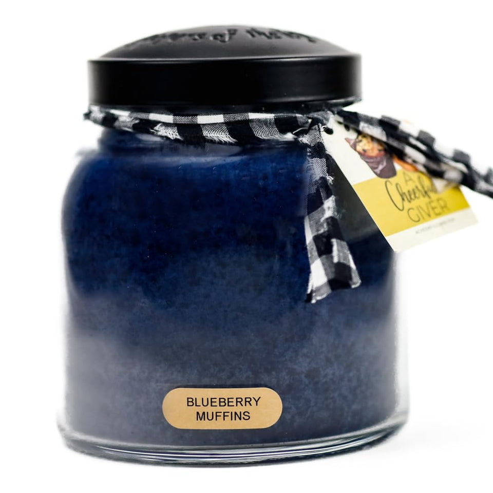 A Cheerful Giver Blueberry Muffins jar with lid creates inviting ambience in cozy spaces.