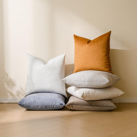 a moment green outdoor pillow cover on patio furniture, designed for weather-friendly use