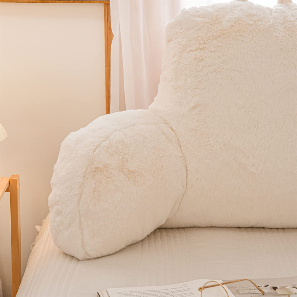A Nice Night ivory faux fur cushion sits stylishly, adding comfort to any seating area