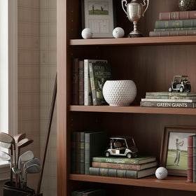 Accents & Occasions ceramic golf ball planter doubles as a chic decorative vase.