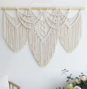 Achart macrame wall hanging large with beige fringe adds cozy boho texture to walls.