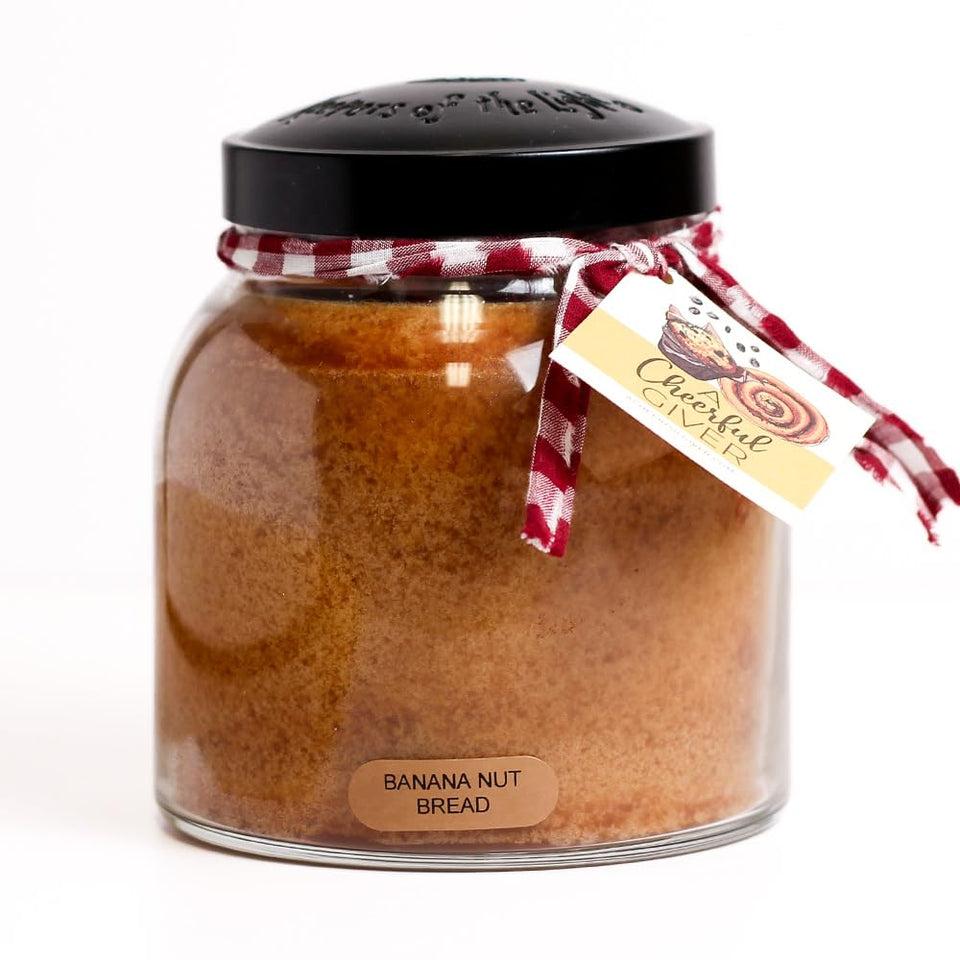A Cheerful Giver Banana Nut Bread candle jar creates cozy ambiance.