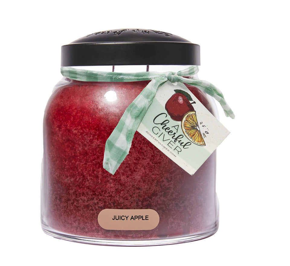 A Cheerful Giver Juicy Apple 34oz candle in a glass jar with a black lid.
