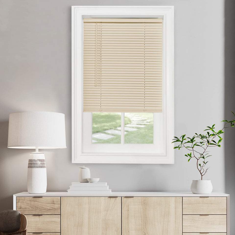Achim cordless light-filtering mini blind in Alabaster blocks glare for daytime privacy.