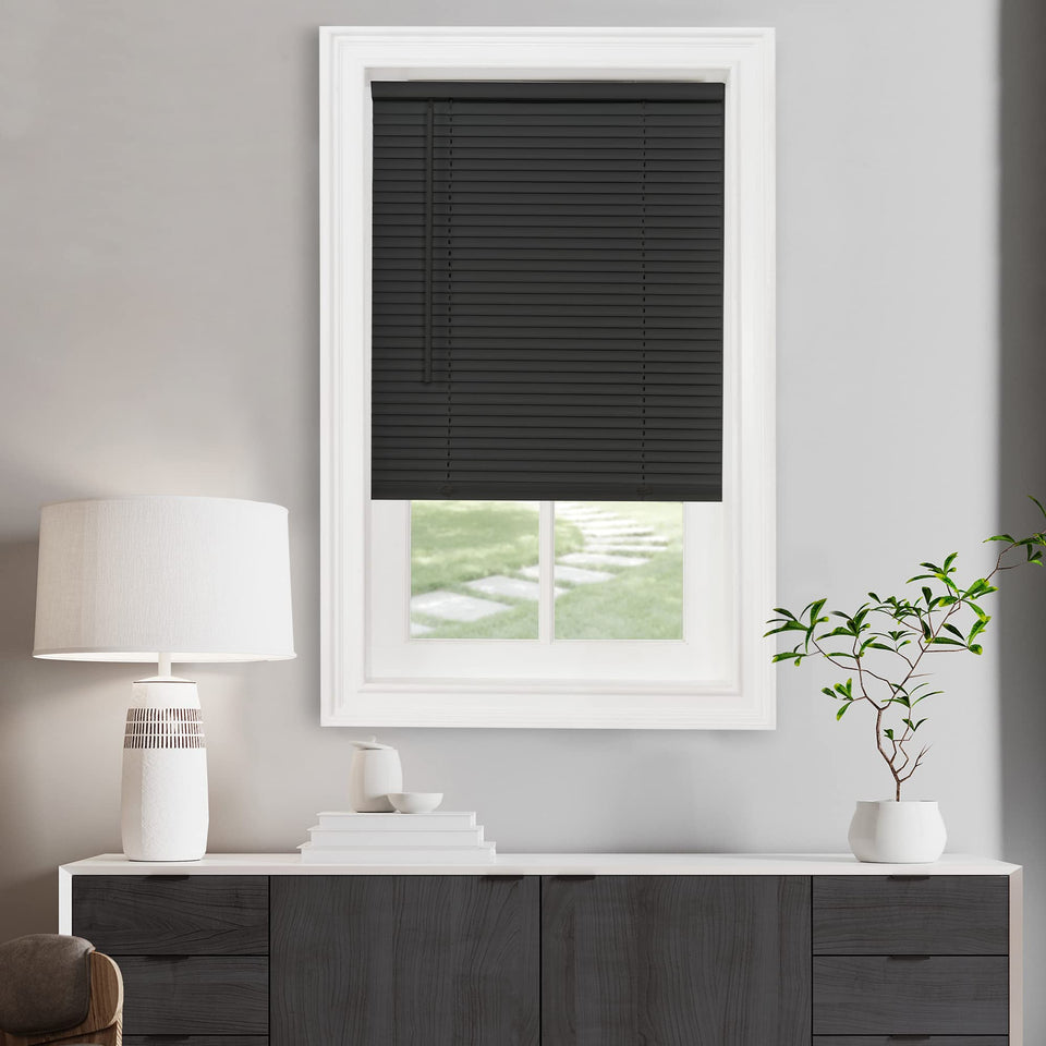 Achim cordless light filtering mini blinds in rolled-down view provide privacy and soft daylight.