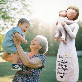 AcowSpt Gigi figurine embracing child captures nurturing moment on display
