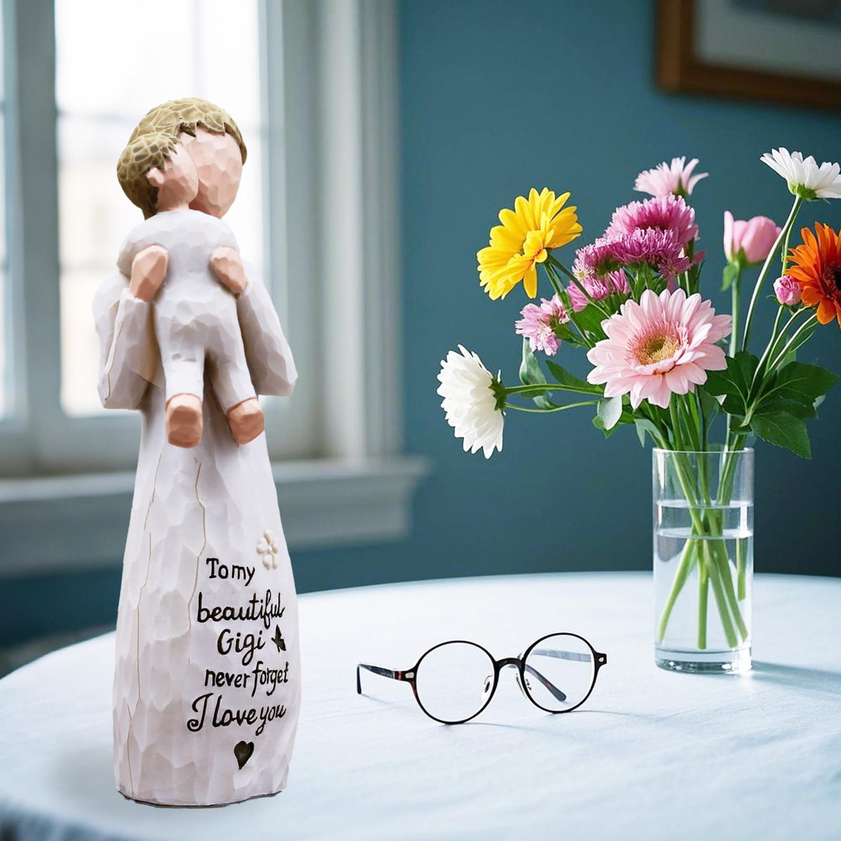 AcowSpt Gigi holding child up figurine, a joyful home decor piece