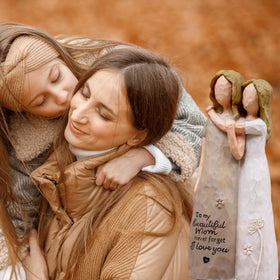 AcowSpt mother-daughter heads-together sculpture captures a close, enduring bond