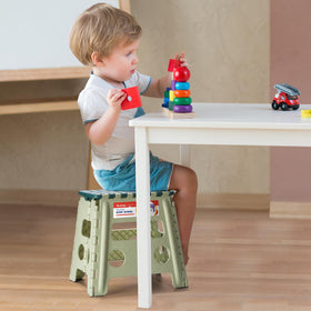 ACSTEP 13-inch folding stool folded in green for compact storage.
