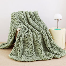 Admitrack chunky knit blanket folded on sofa adds instant texture and elegance.