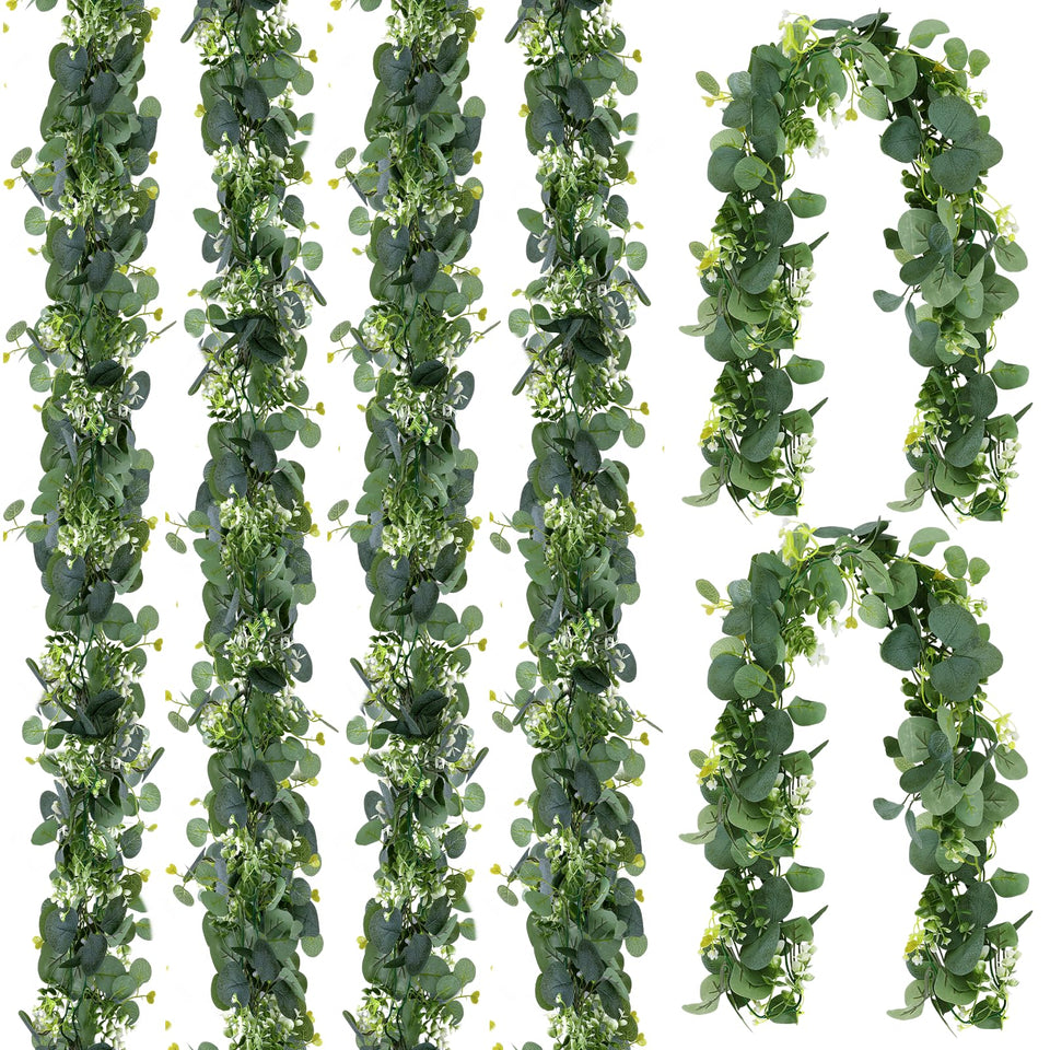 Aeaocvo eucalyptus garland with leaves and white flowers for elegant table decor.