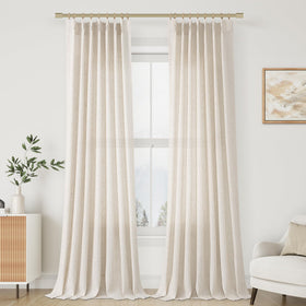 Aersas pleated linen curtains shown on a window with elegant folds and warm light