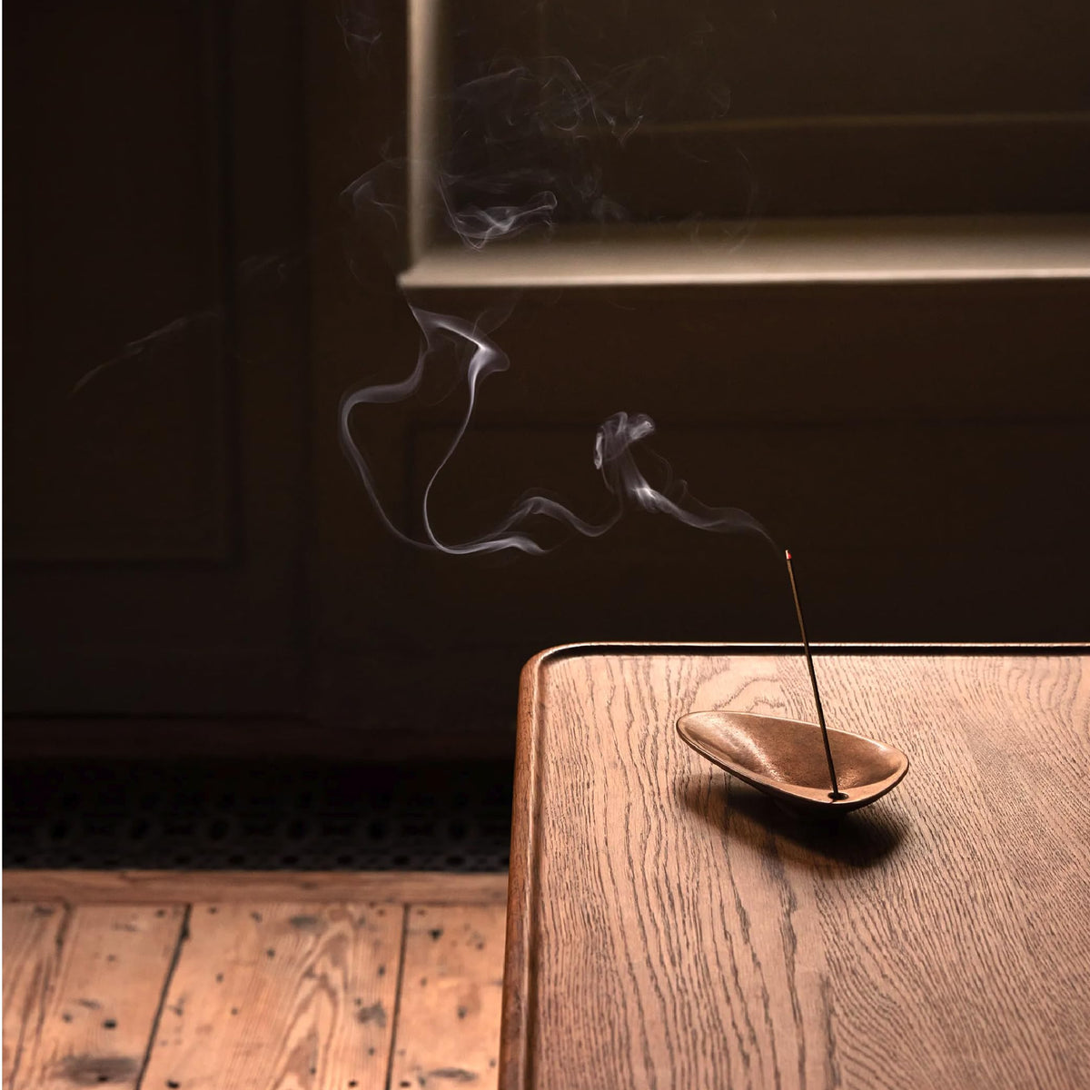 Incense burning in use delivering gentle aroma release for evenings
