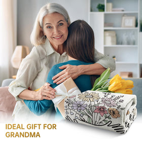 Afterprints hug floral throw closeup displays soft flannel texture for cozy moments