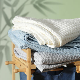 Aganear blanket placed on bed for sofa-side use
