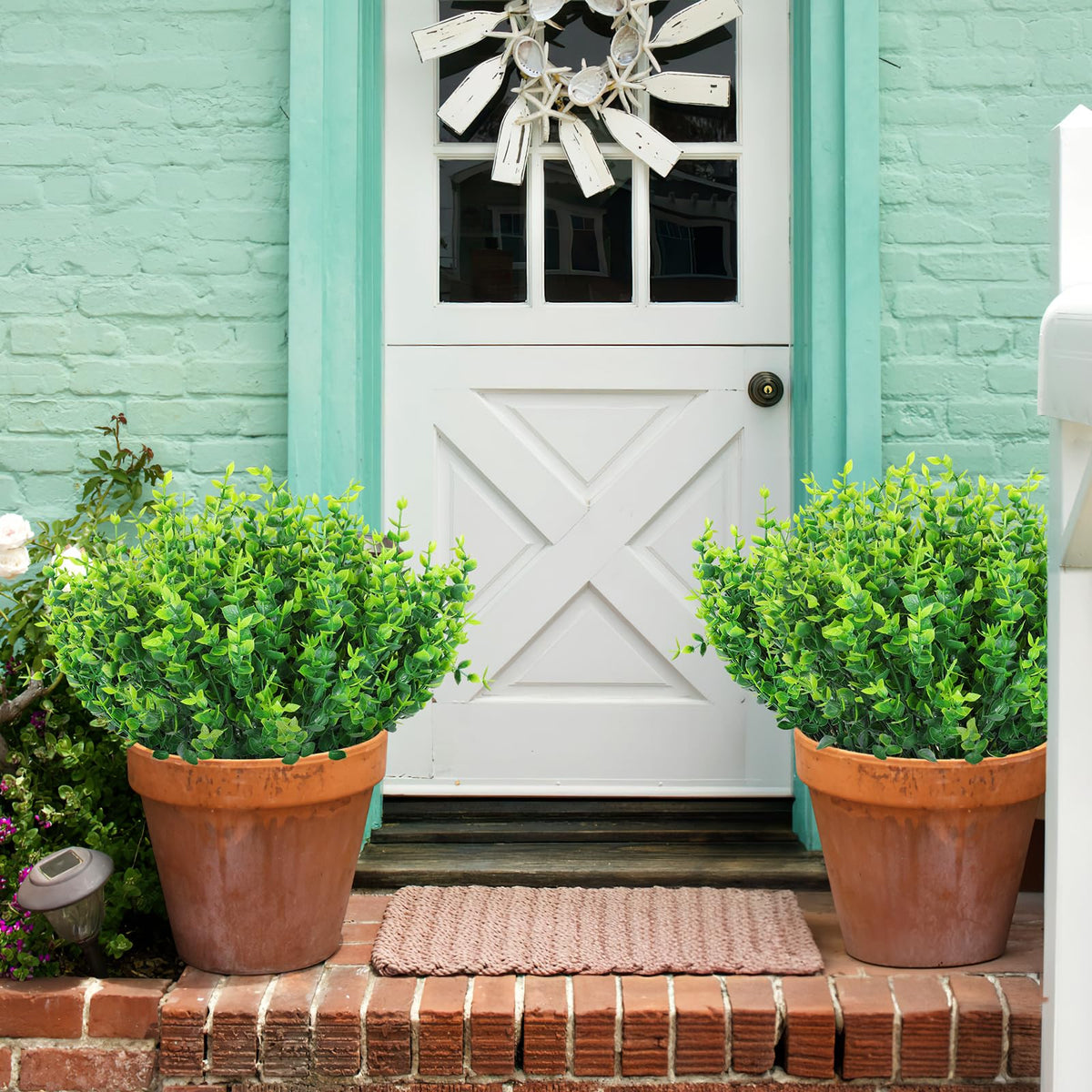 AGIRL greenery on terraces and porches brings year-round color.