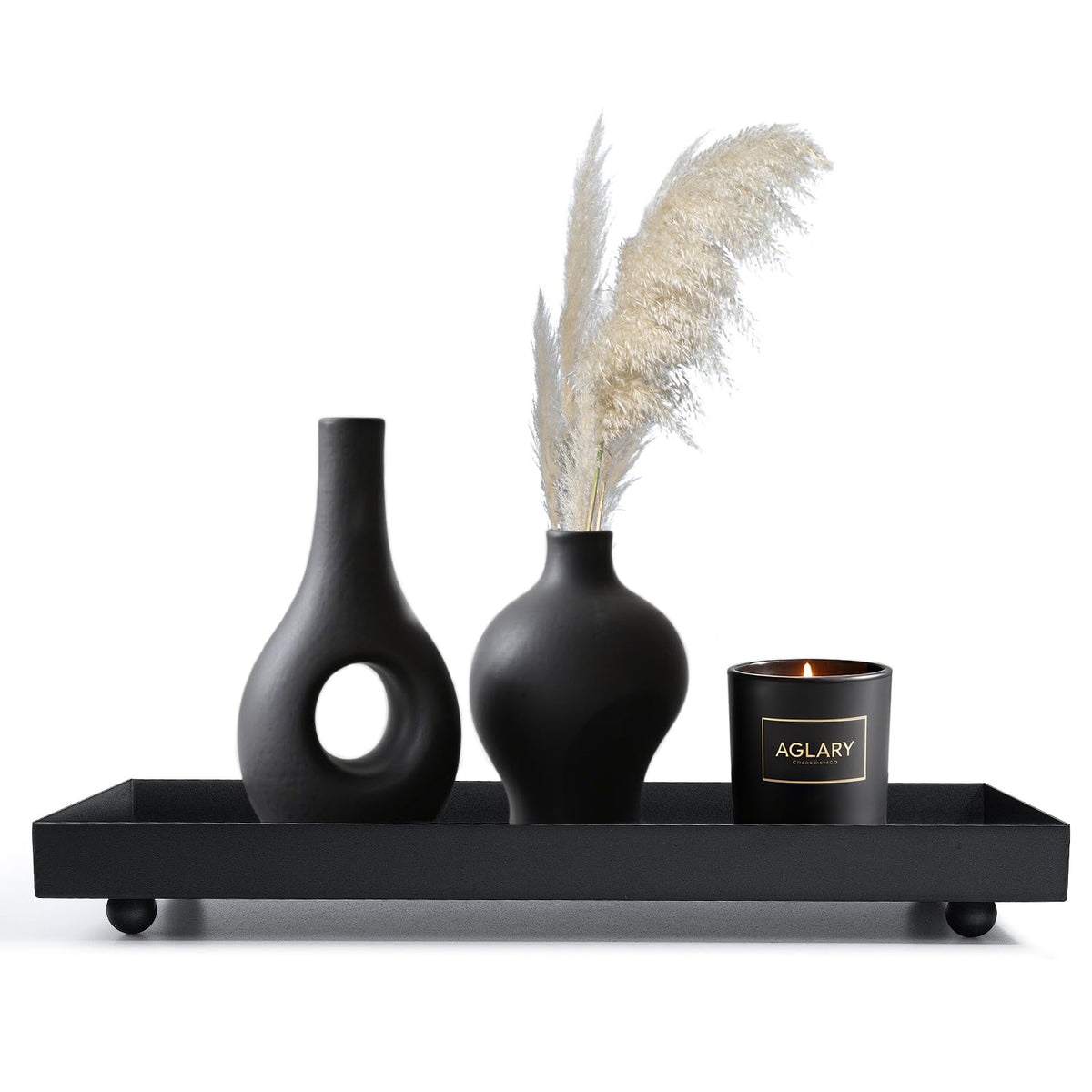 AGLARY Rectangle Black Matte Metal Tray candle holder base for an elegant living room display.