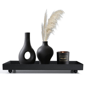 AGLARY Rectangle Black Matte Metal Tray candle holder base for an elegant living room display.