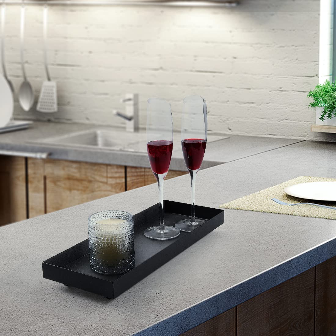 AGLARY Rectangle Black Matte Metal Tray centerpiece display on coffee table.