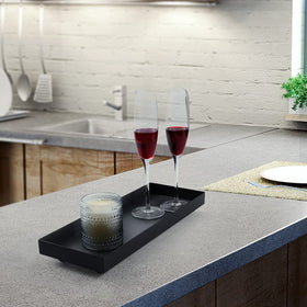 AGLARY Rectangle Black Matte Metal Tray centerpiece display on coffee table.