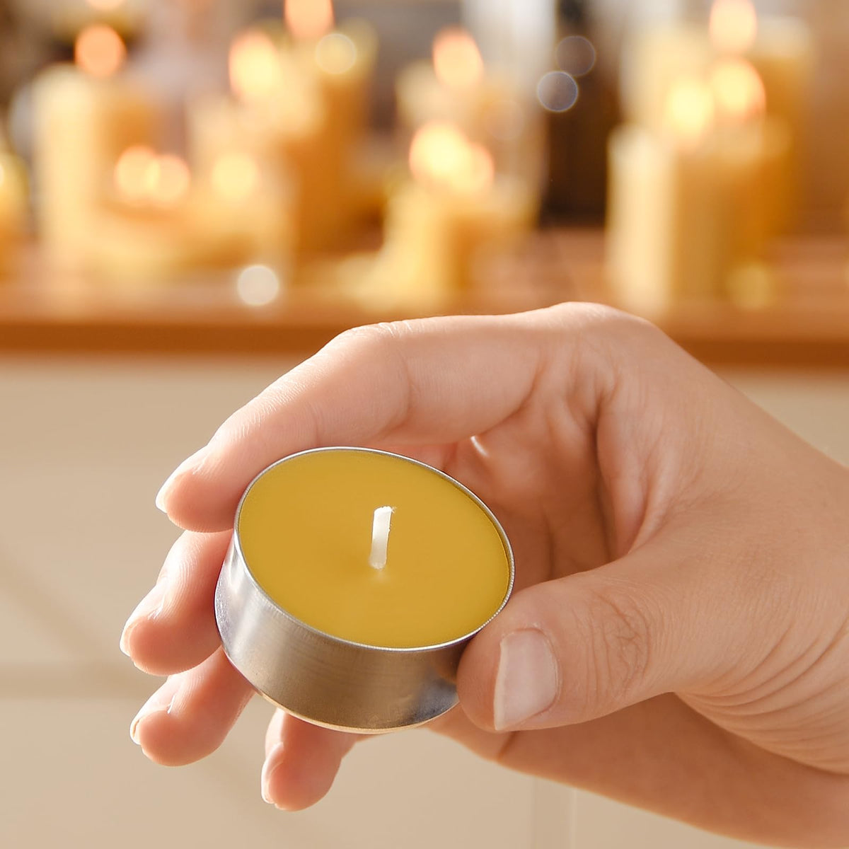 AGLARY tealights in reusable aluminum cups supporting waste-conscious lighting.
