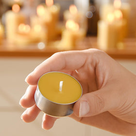 AGLARY tealights in reusable aluminum cups supporting waste-conscious lighting.
