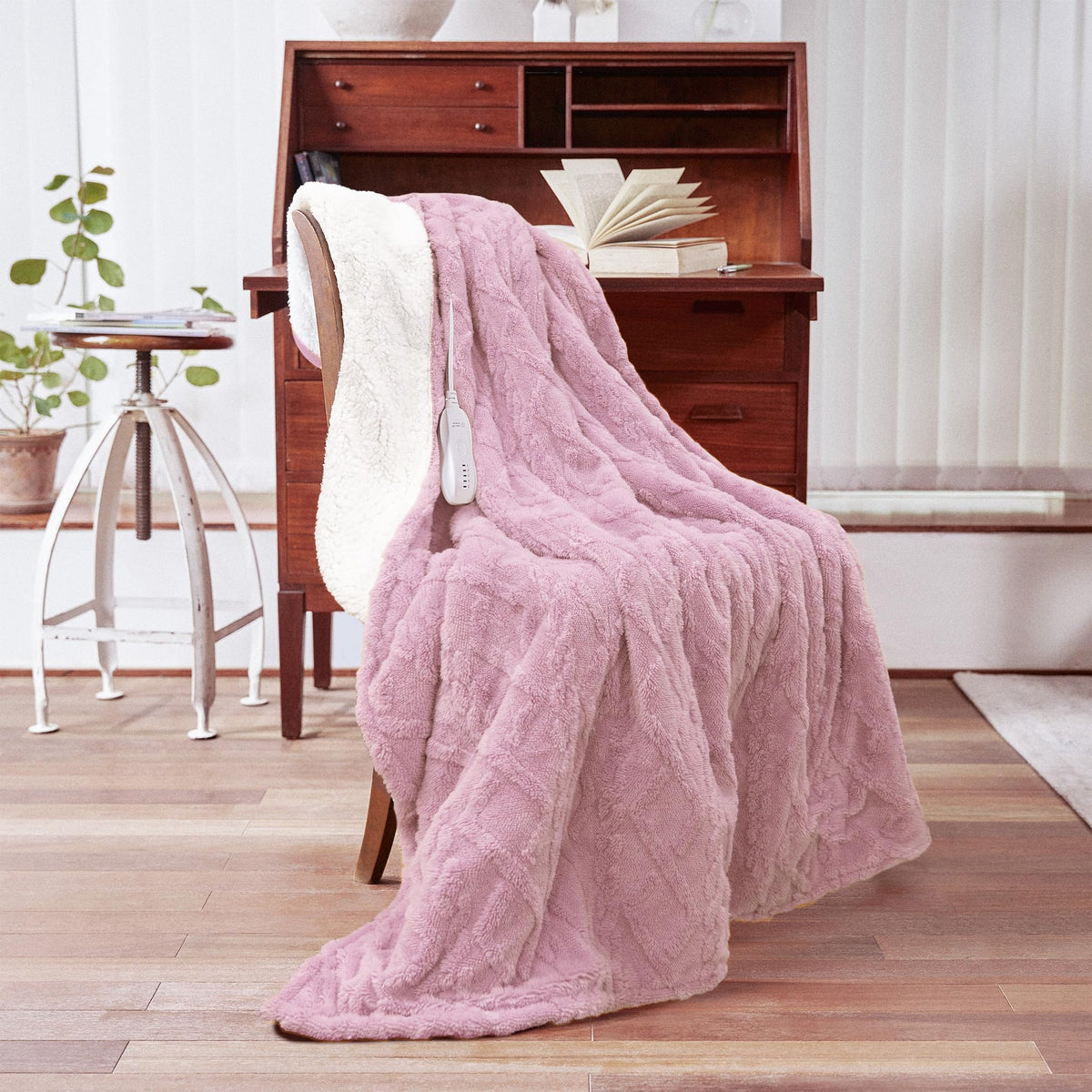 Aheadpret heated blanket on sofa for cozy evenings.