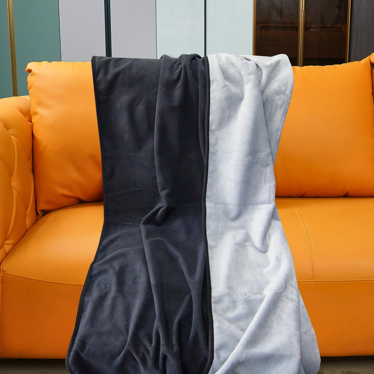 Ahinahwap waterproof blanket on bed and couch protecting against spills.