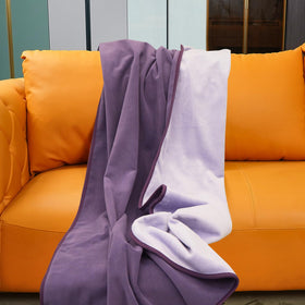 Ahinahwap waterproof blanket on bed with deep purple surface keeps furniture dry