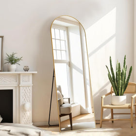 Aidoly arched mirror complements bedroom decor and space