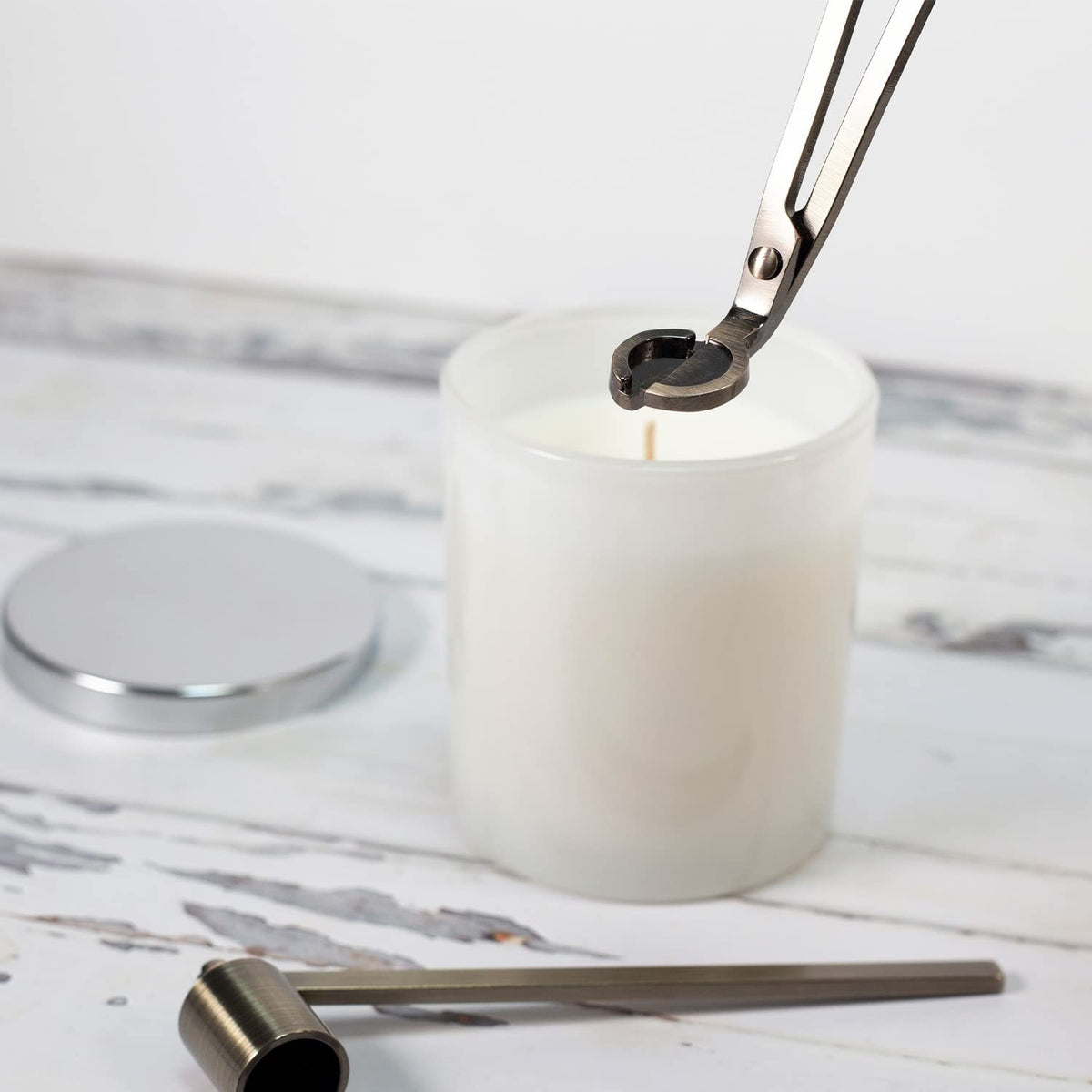 Airy Abode snuffer in black safely extinguishes flames with reduced smoke.