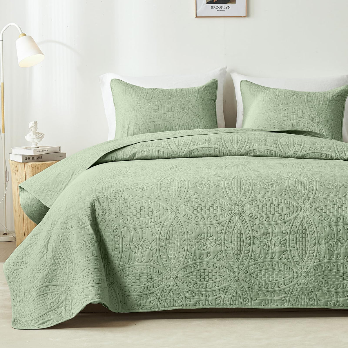 Akkialla queen quilt in sage green with coin pattern, lightweight and cozy for all seasons.