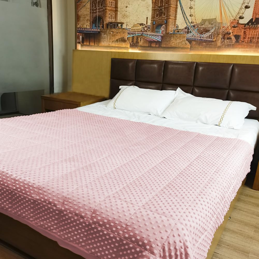 ALANSMA pink velvet blanket enhances cozy bedroom ambiance.