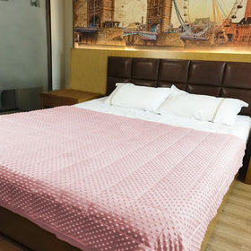 ALANSMA pink velvet blanket enhances cozy bedroom ambiance.