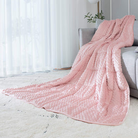 ALANSMA reversible velvet weighted blanket in pink provides gentle warmth.