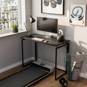 Alawooder folding desk folded flat for easy storage behind a door