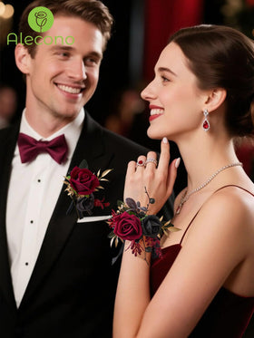 Alecono red and black rose boutonniere with elegant finish for the groom.