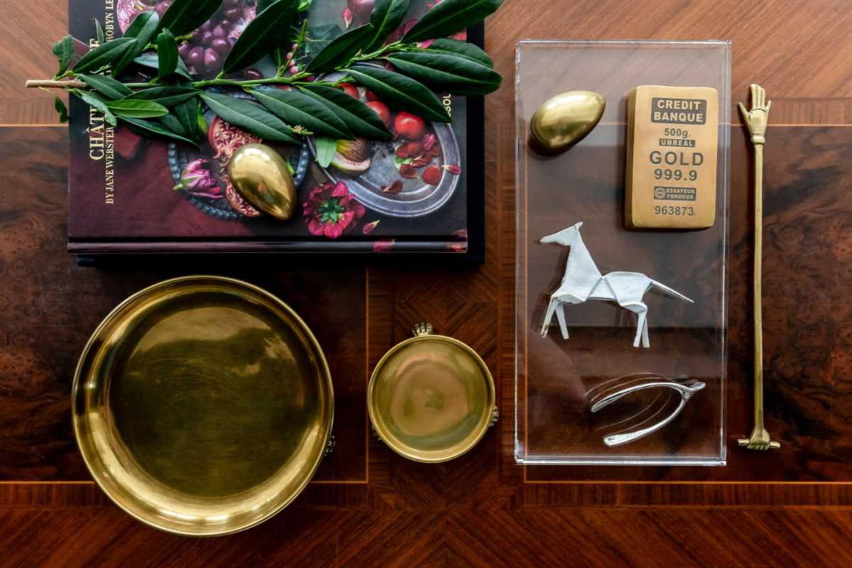 Alice Lane Round Clawfoot Dish gold holds perfume bottles with style.