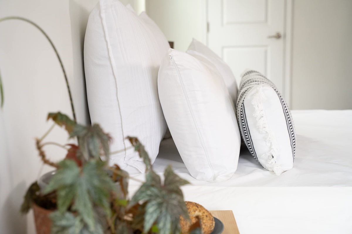 AllerEase breathable cotton fabric close-up shows soft touch and airflow for cooler nights.