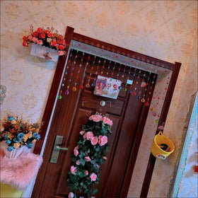 Alpengulen curtain doorway-divider close-up demonstrates vivid rainbow beads.