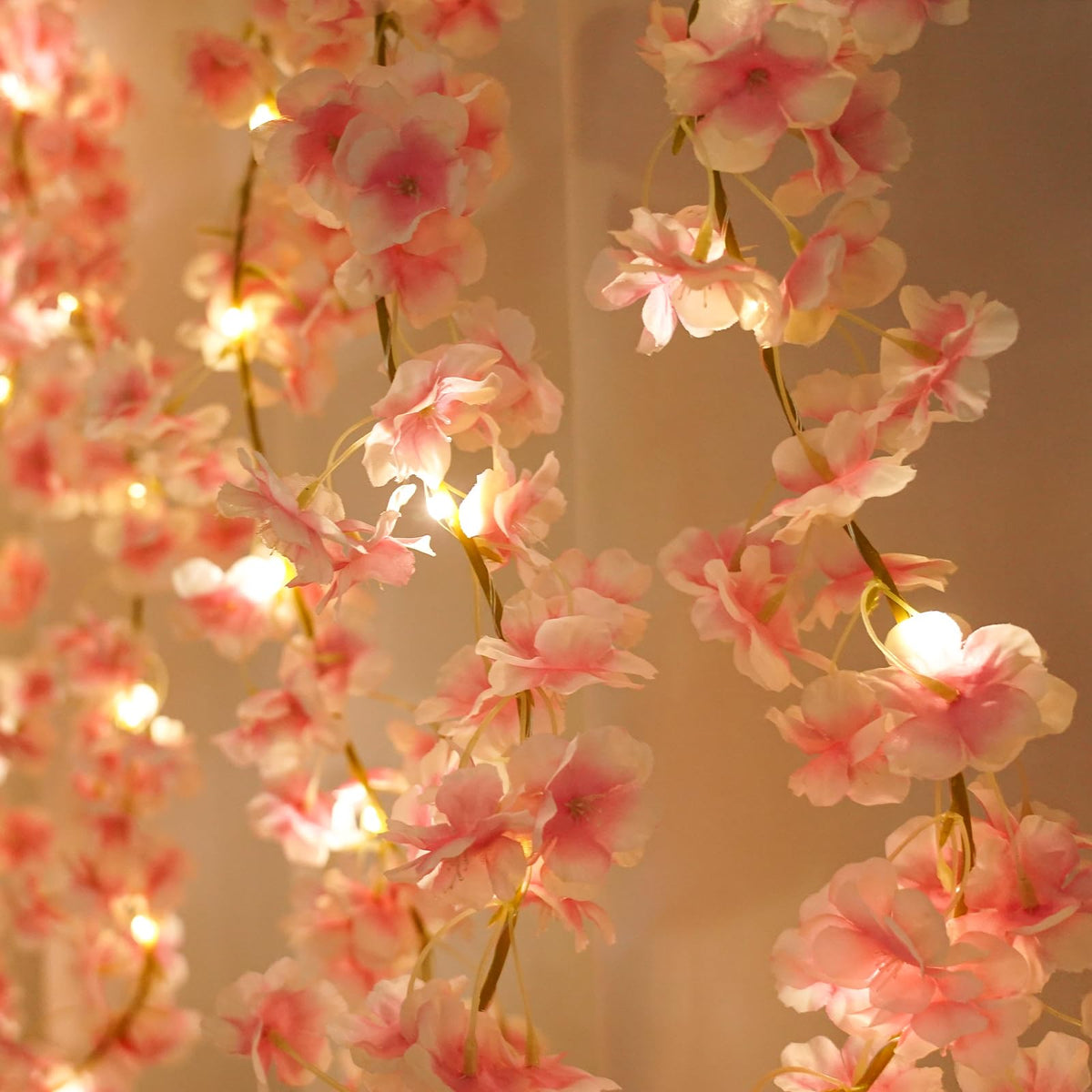 Alpha Decor wedding backdrop cherry blossom vine adds soft pink focal points.