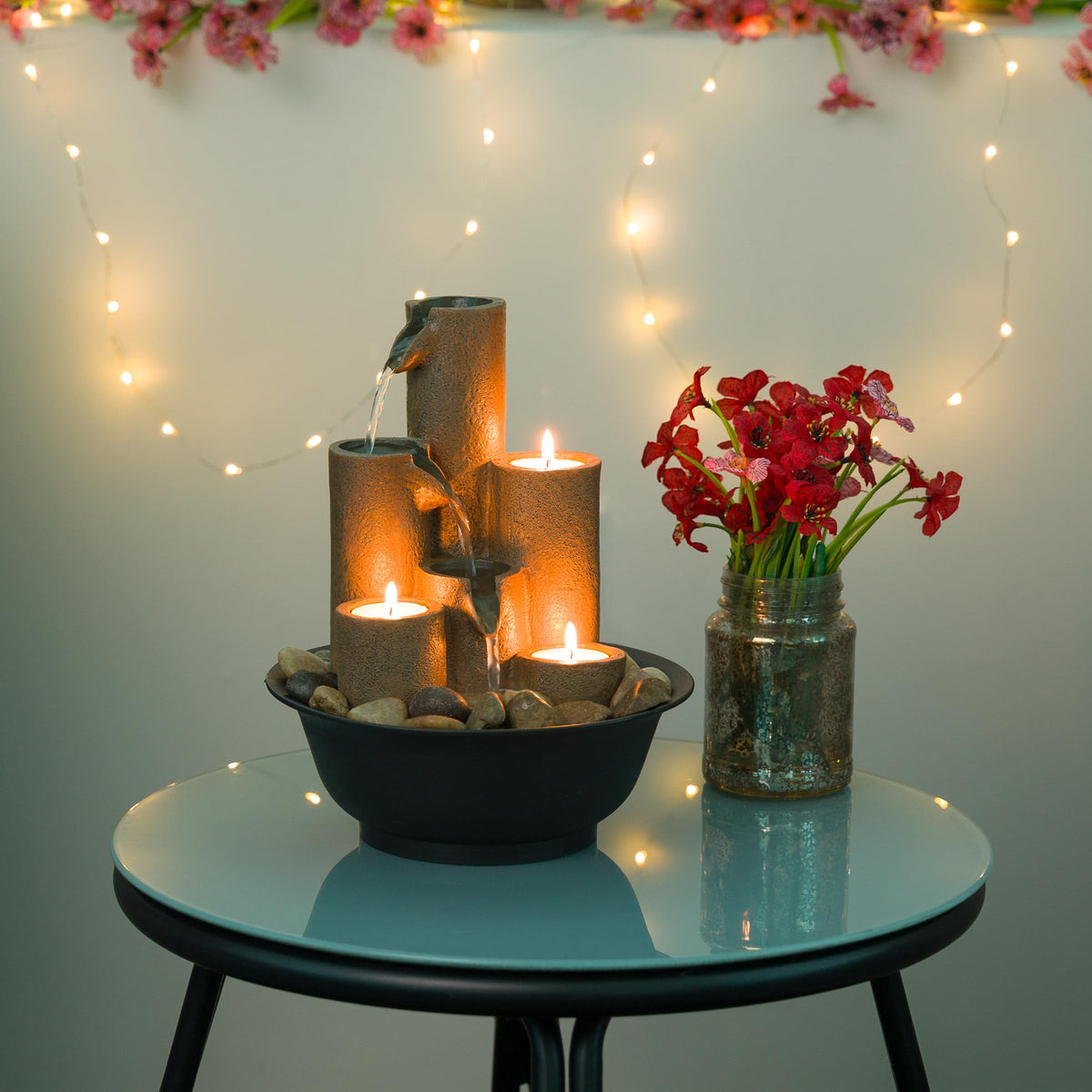 Alpine WCT202 tealight holders provide warm glow with gentle water sounds for cozy evenings.