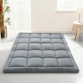 ALPSWAN Japanese floor mattress folded for compact storage and portability.