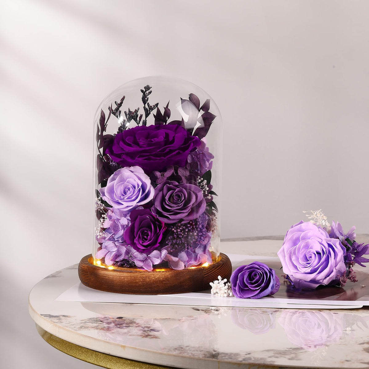 Alupssuc purple preserved rose inside a dome; symbol of enduring affection.