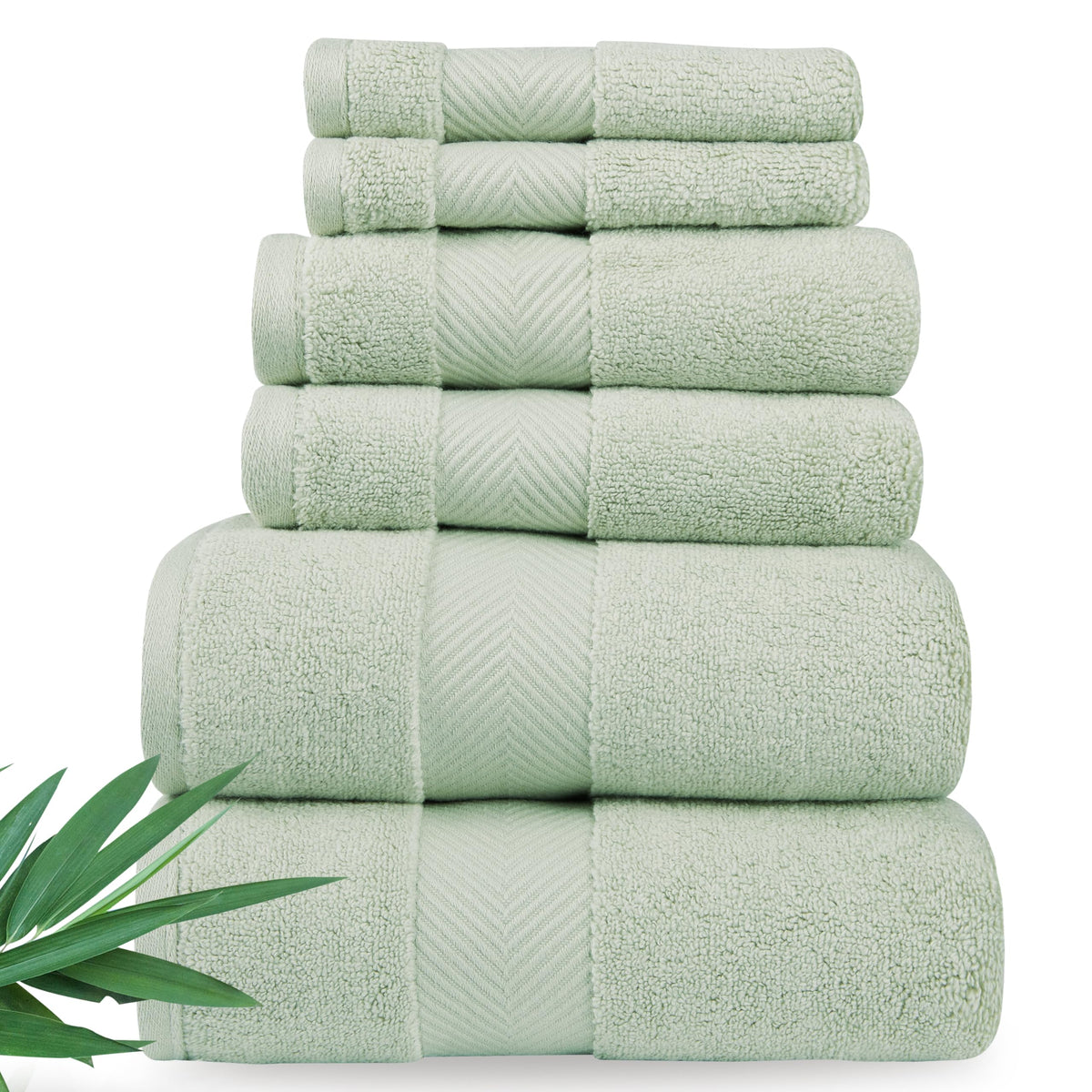 Alusa Home towel folded on rack, showcasing plush softness and premium bamboo blend.